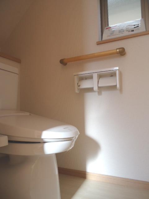 Toilet. Roll are also two installation with a handrail and windows!