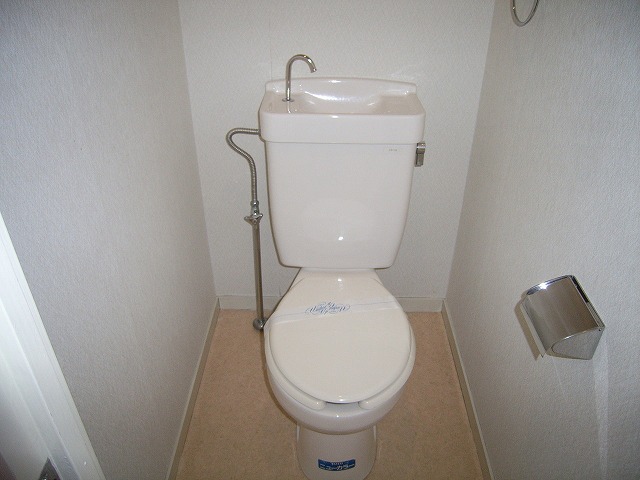 Toilet. It is a restroom that is clean