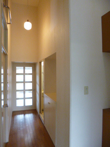 Other. High-ceilinged hallway with attic storage