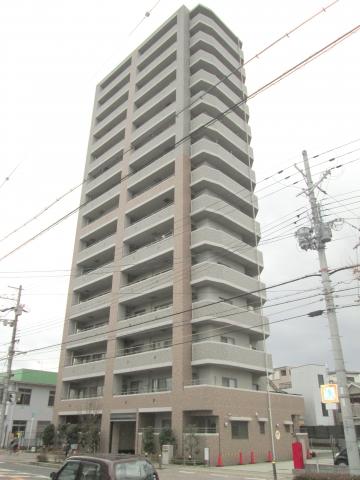Local appearance photo. The ground is a 15-story apartment