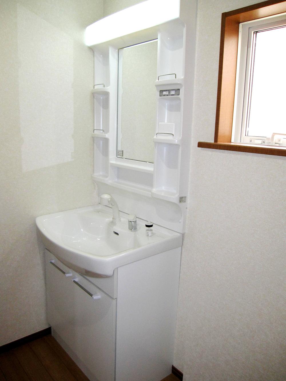 Wash basin, toilet. Wash basin with a retractable shower head
