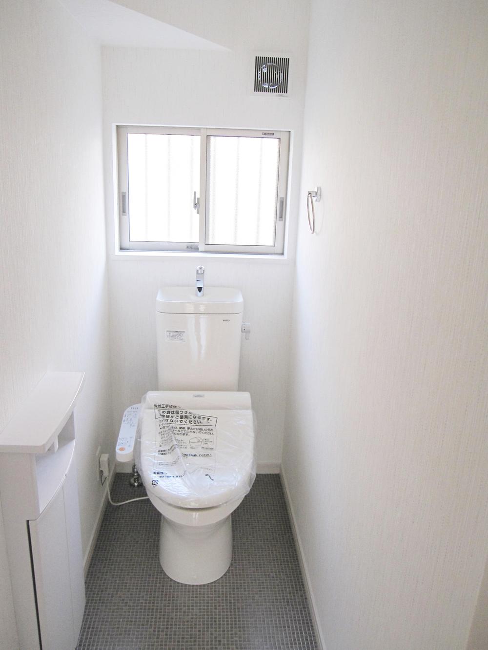 Toilet. Convenient storage has been installed Washlet