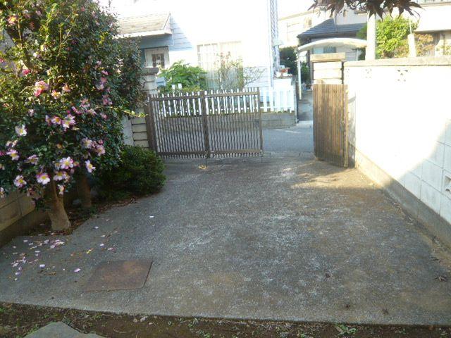 Parking lot. Parking spaces containing a portion of the gate
