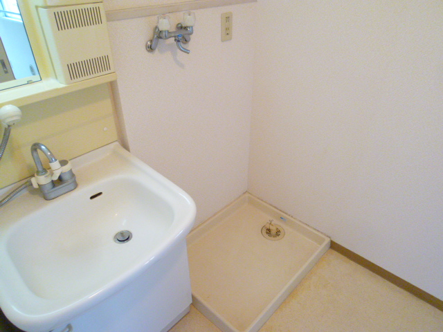 Washroom. Also independent wash basin! Indoor Laundry Storage is also equipped!