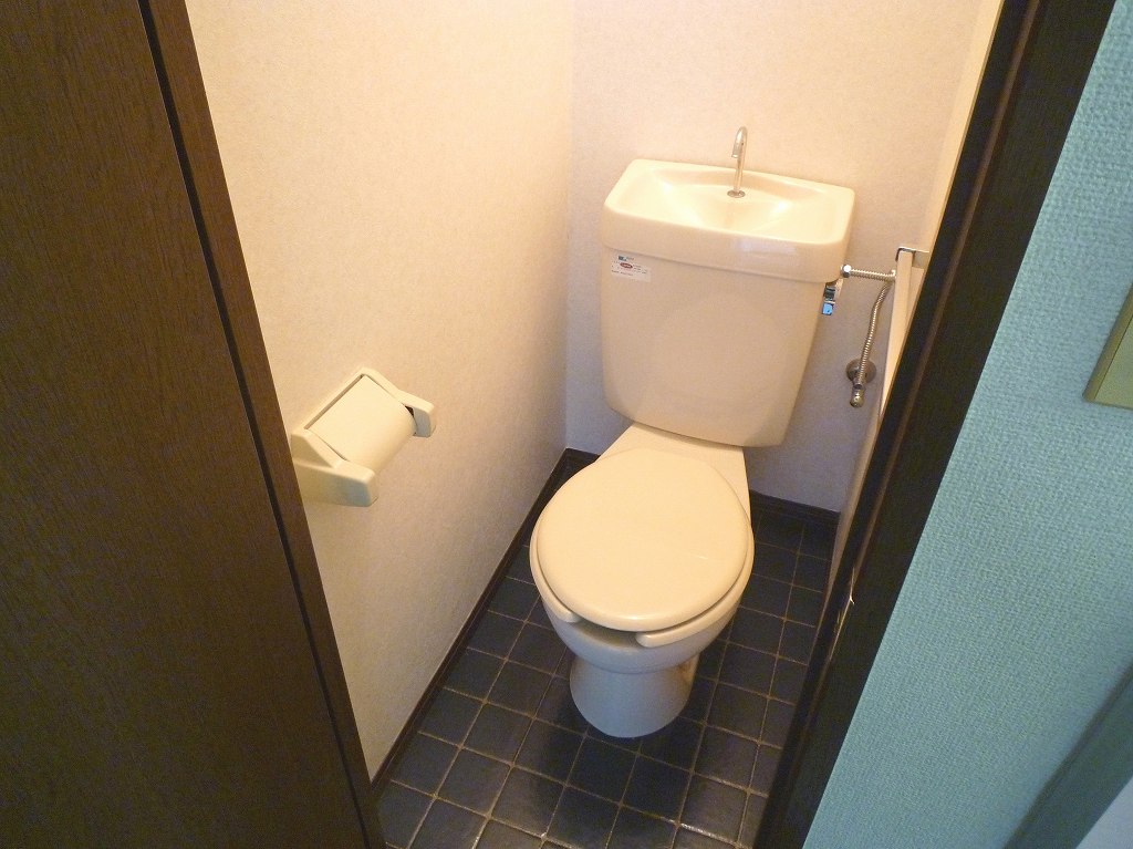 Toilet. The same is by Property of the room