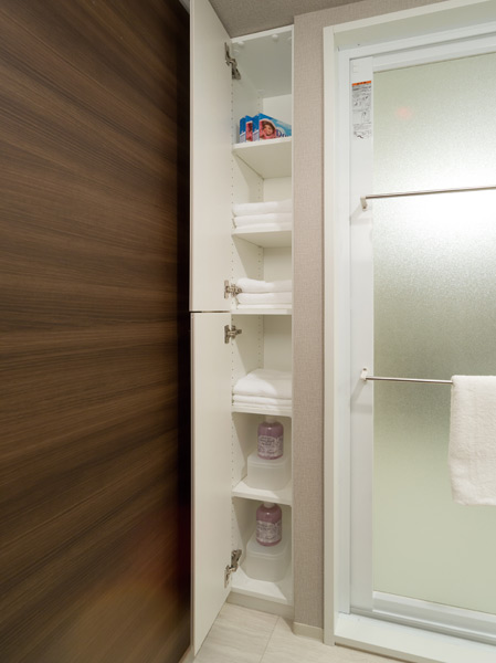 Bathing-wash room.  [Linen cabinet] The lavatory has established a convenient linen warehouse for storage, such as towels or stock up on goods.