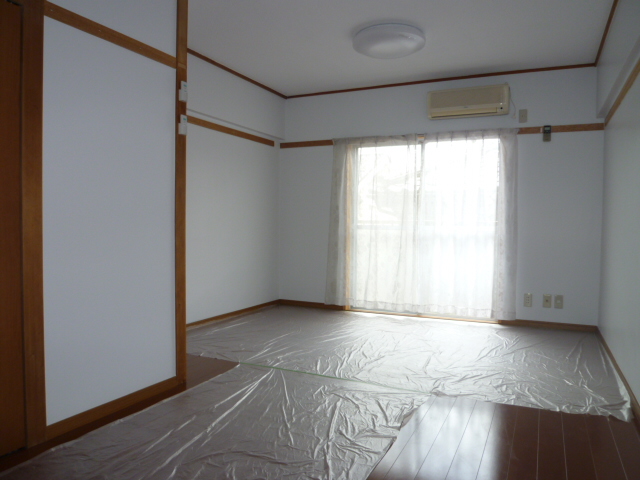 Living and room. It is a photograph of another room