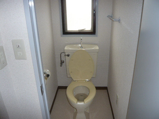 Toilet. Same property, It is a photograph of a different type of room