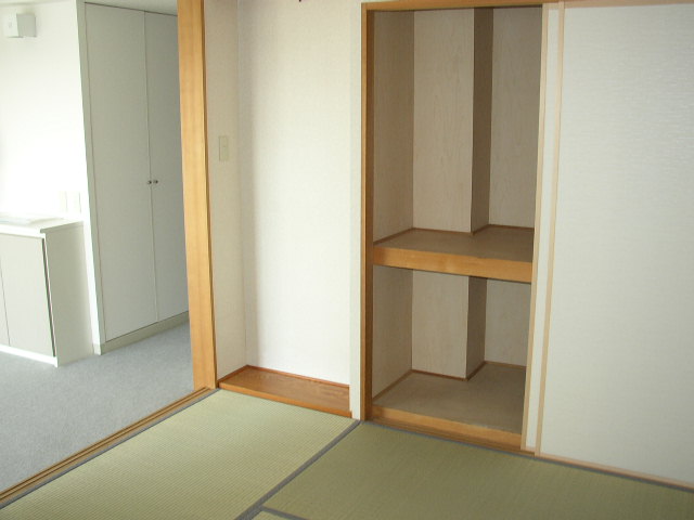 Living and room. It is a photograph of another room