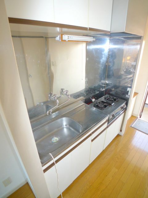 Kitchen. It is a photograph of the inverted type different rooms. 