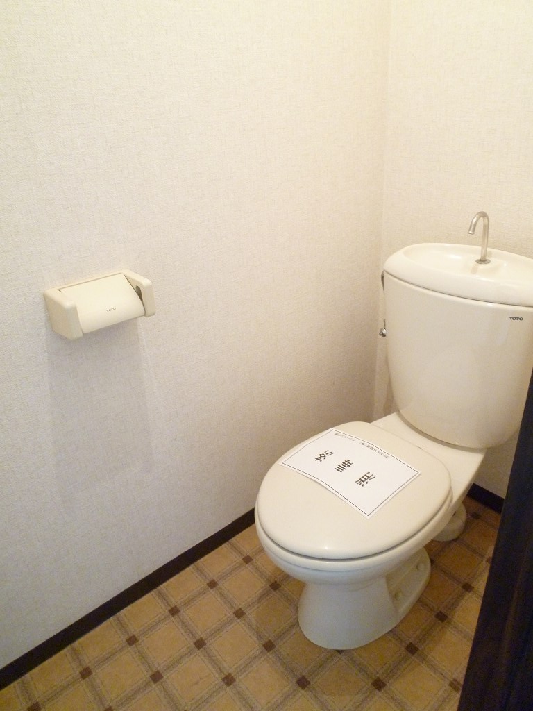 Toilet. It is a photograph of the same property another room