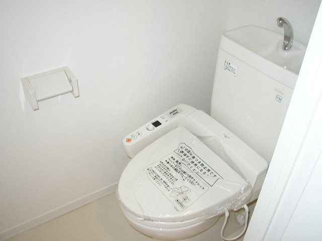 Toilet. Same property, It is a photograph of another room