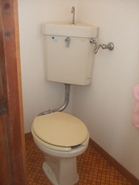 Toilet. It is a photograph of another in Room. 