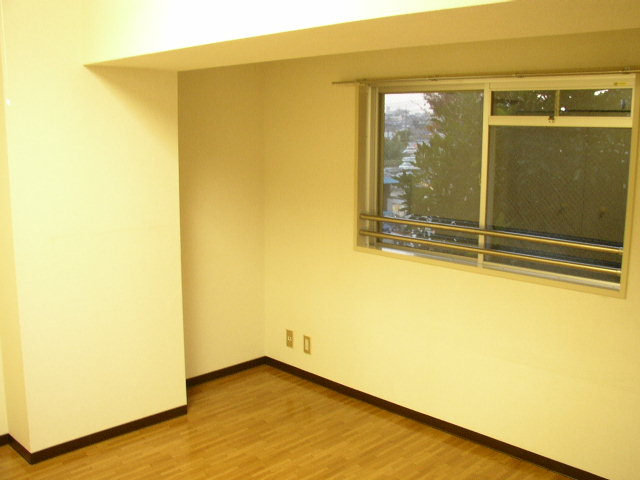 Living and room. It is a photograph of another room