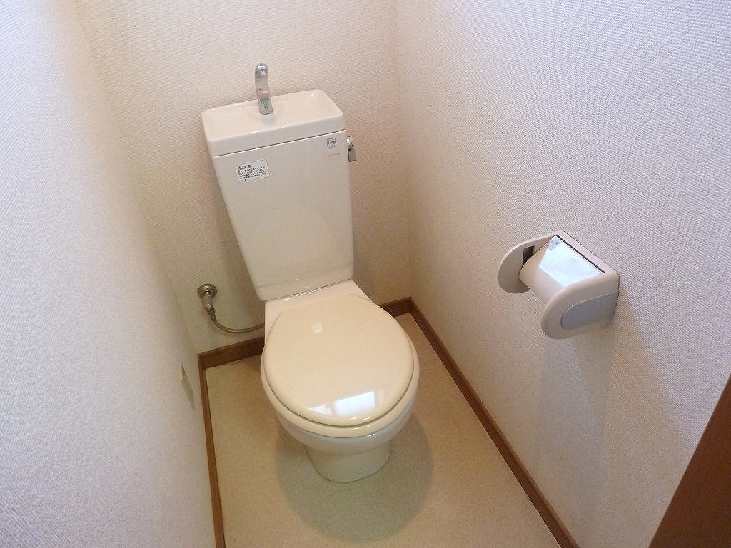 Toilet. There is a small window in the toilet