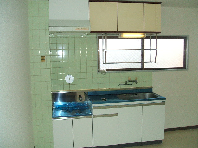 Kitchen. It is a photograph of another room of the same type