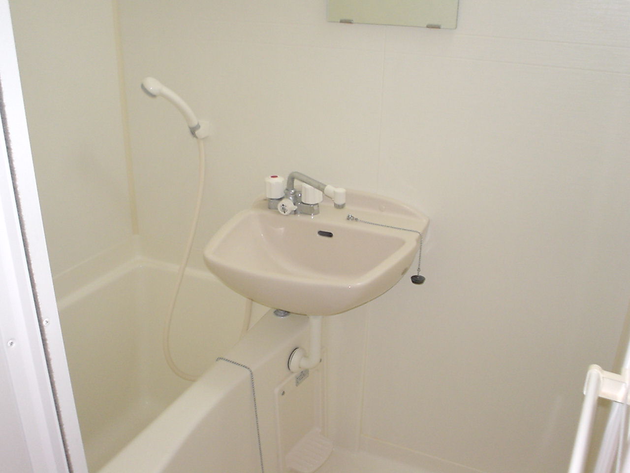 Bath. It is a bathroom with a shower. It is with a bathroom ventilation dryer. 