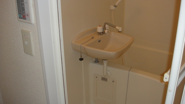 Bath. It is a bathroom with a shower. With bathroom ventilation dryer. 