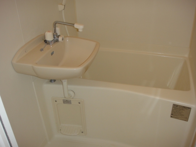 Bath. It is with a shower. It is with a bathroom ventilation dryer.