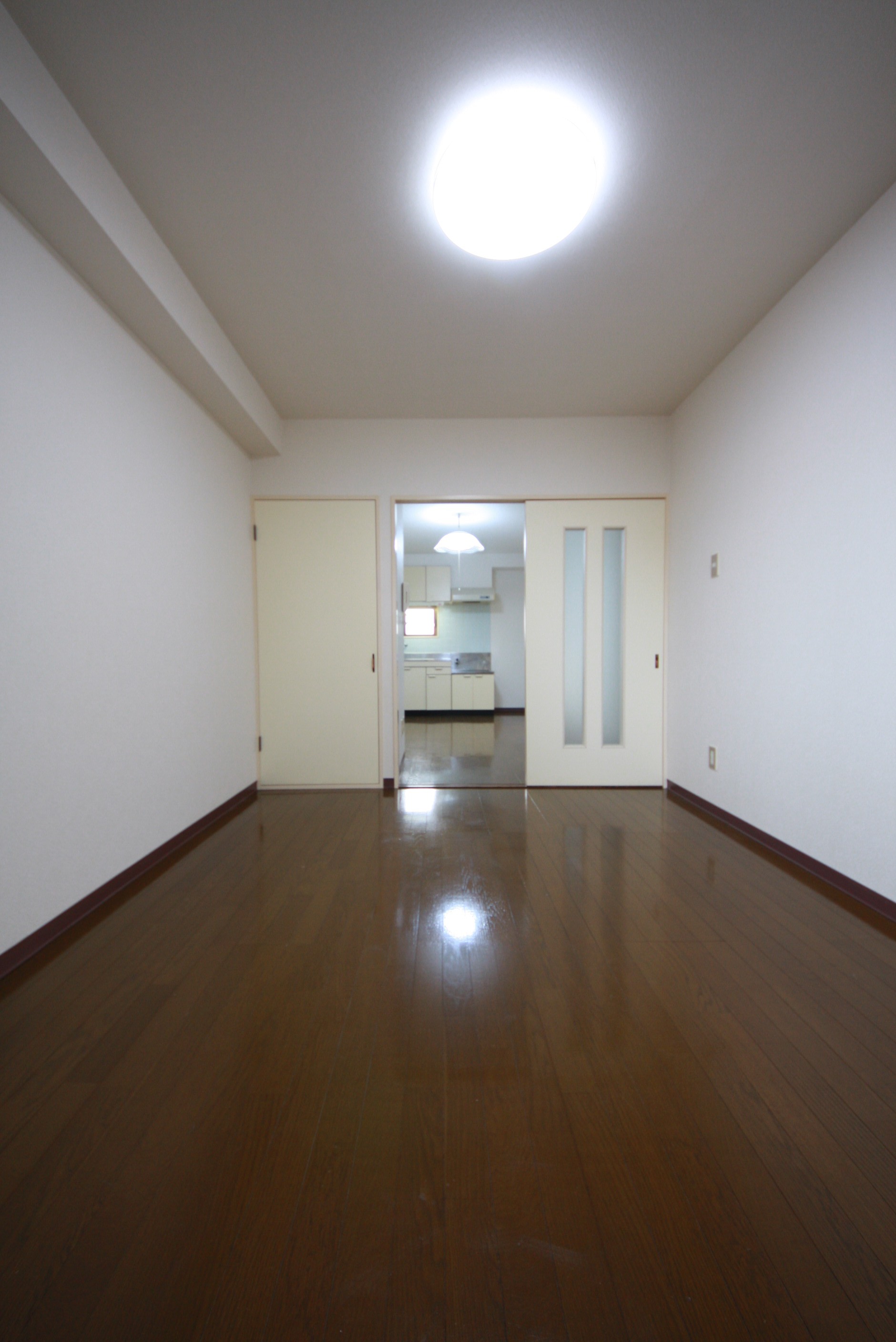 Living and room. It is a photograph of the room on the same floor plan.