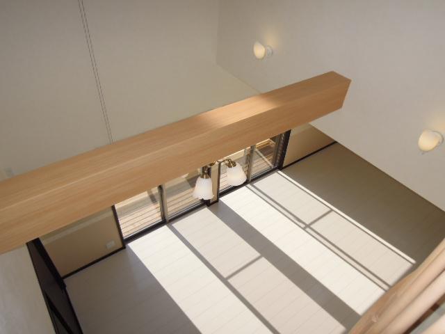 Living. Will be in the photo from the living room vaulted ceiling second floor. 