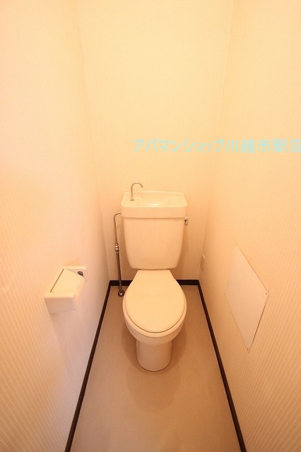 Toilet.  ■ Indoor photo is a picture of another room