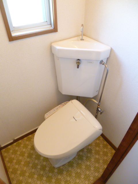 Toilet. Comfortable with a small window