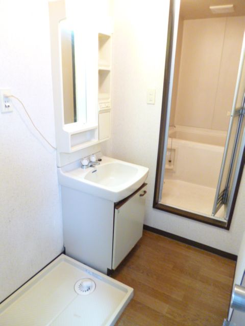 Washroom. Popular independent wash basin and washing machine inside the room