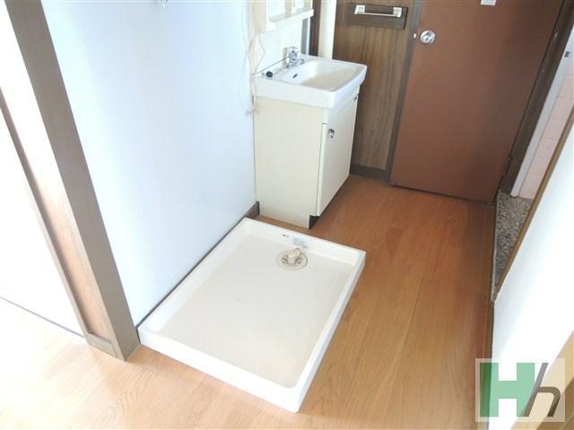 Washroom. There is a separate wash basin and washing machine yard.