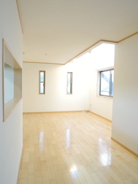 Living and room. Bright light plugs into the stairwell.