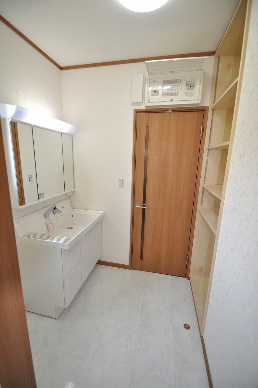 Wash basin, toilet. B Building washroom. Also it comes housed in a bright feel of the room.