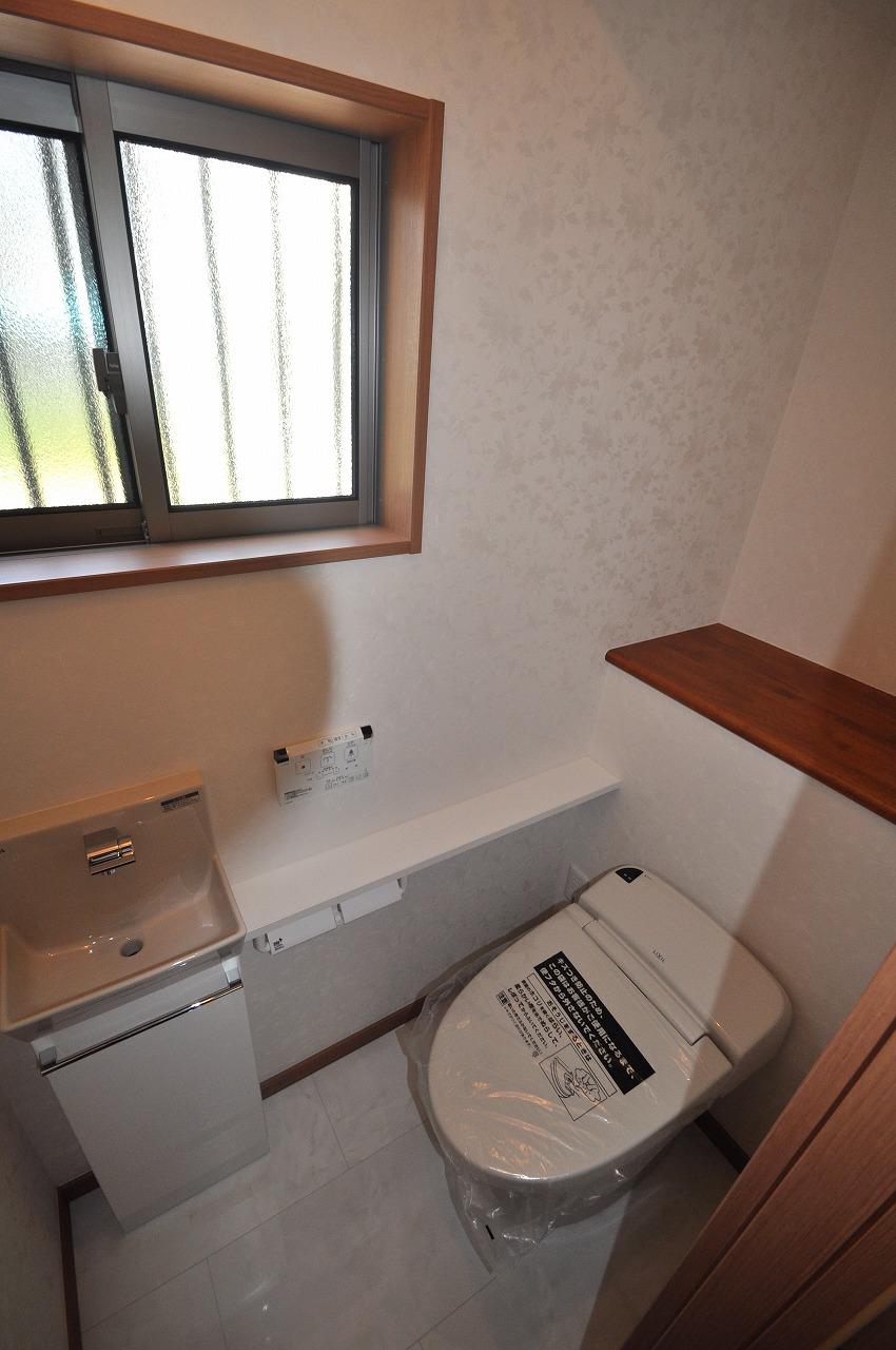 Toilet. B Building first floor toilet. Clean, tankless. Also it comes with a hand-wash.