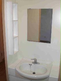 Washroom. It comes with a storage rack to wash basin of the side that was valuable white.