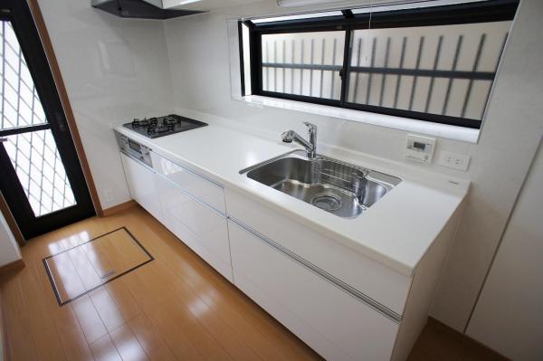Kitchen. Underfloor storage is likely to help in storage of food!
