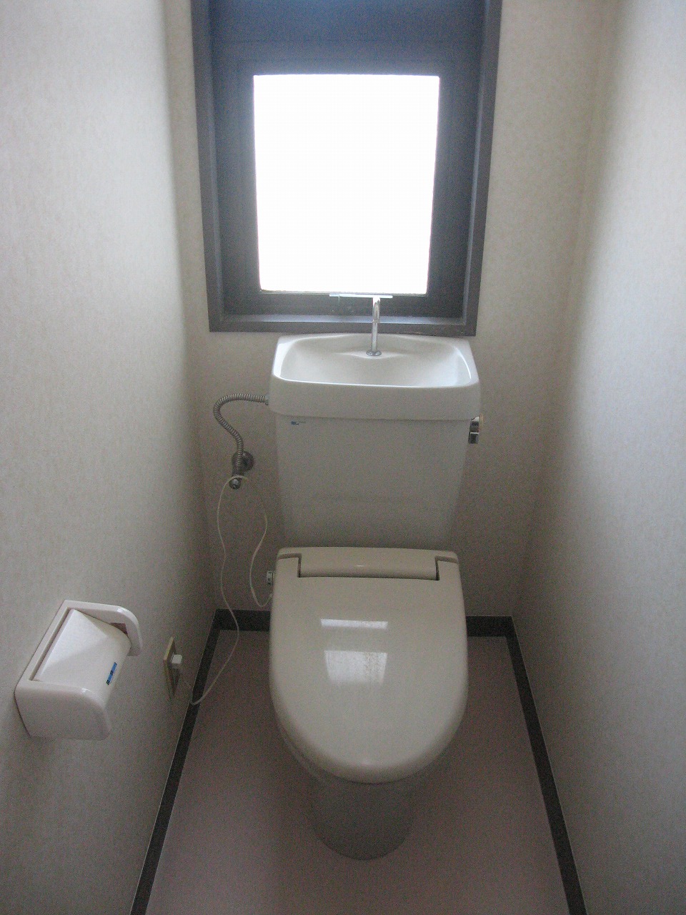 Toilet. It has a window in the toilet