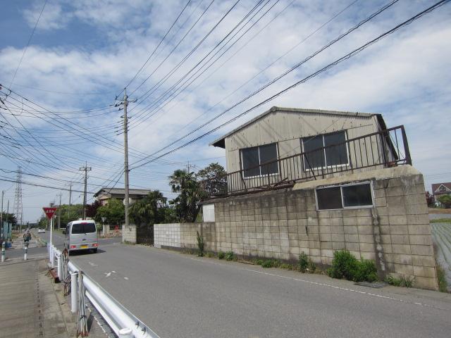 Local photos, including front road. Front road is equipped with sidewalk. 