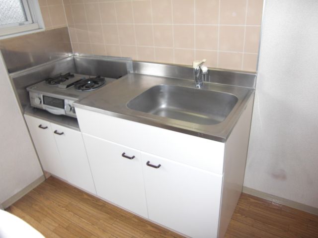 Kitchen. Two-burner gas stove corresponding sink also spacious