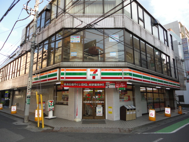 Convenience store. Seven-Eleven Koshigaya Station East store up (convenience store) 53m