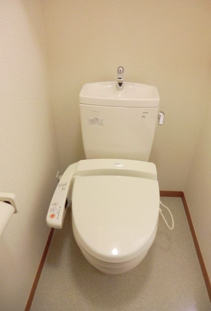 Toilet. Warm water cleaning toilet seat with your toilet. Cleanliness is it is important.