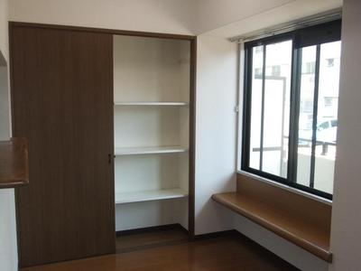 Living and room. There is storage of built-in living room