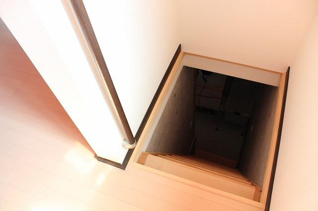 Non-living room. Stairs leading from the garage.
