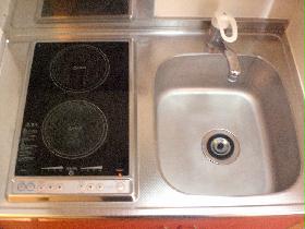 Kitchen. With electric stove. There is storage space in the up and down