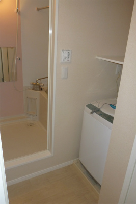 Washroom. Also it comes with a washing machine.