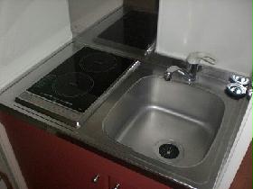 Kitchen. In two-burner stove, Cooking is smooth. 