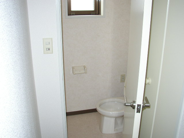 Toilet. The same is by Property of the room