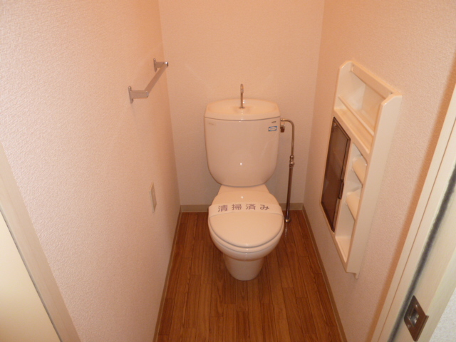 Toilet. It is a photograph of another room of the same properties