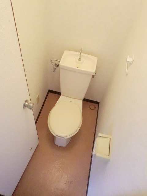 Toilet. It will be in the photo of another in Room. 