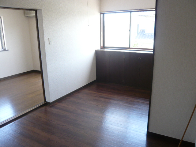 Living and room. It is a photograph of another room in the same building. 