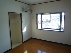 Living and room. It is with in-room laundry Area (The photograph is an image)