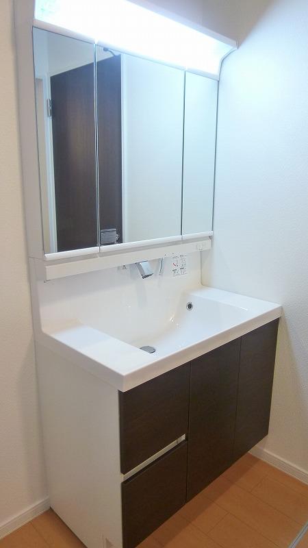 Wash basin, toilet. A Building Bathroom vanity